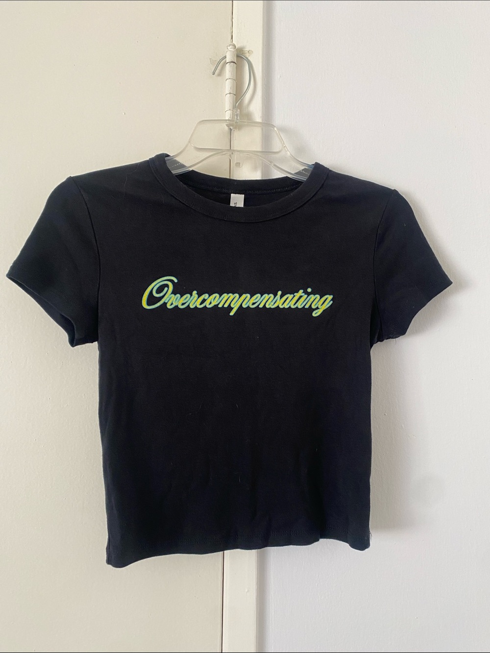 NWOT - crop black tee “Overcompensating”